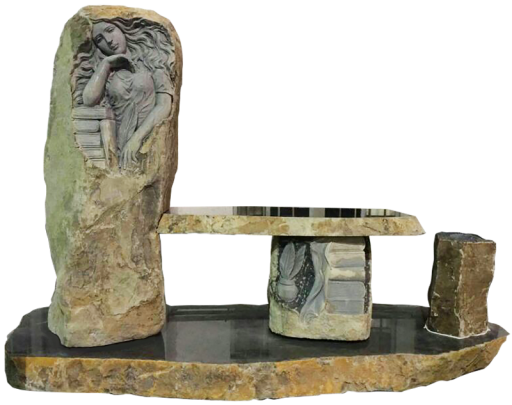 Rustic boulder with sculpted carving and cremation chambers